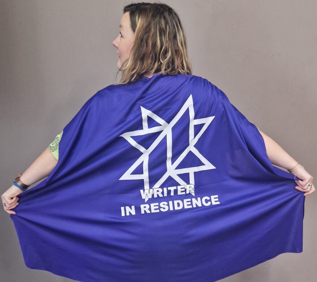 Lisette wearing her Writer In Residence cape